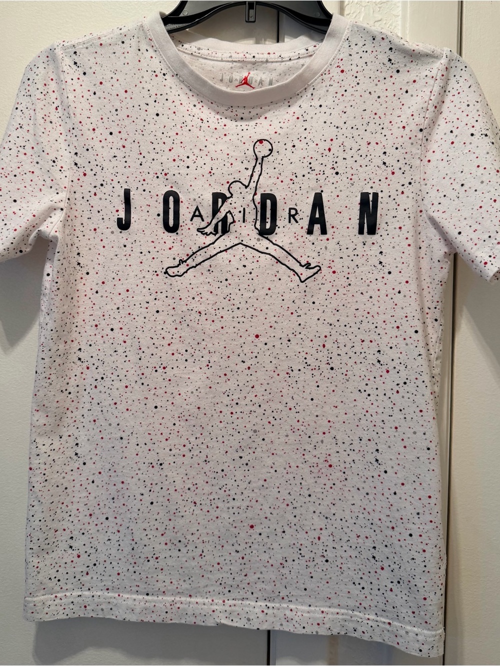 Jordan White Short Sleeve Tee with Red and Black Speckle Logo